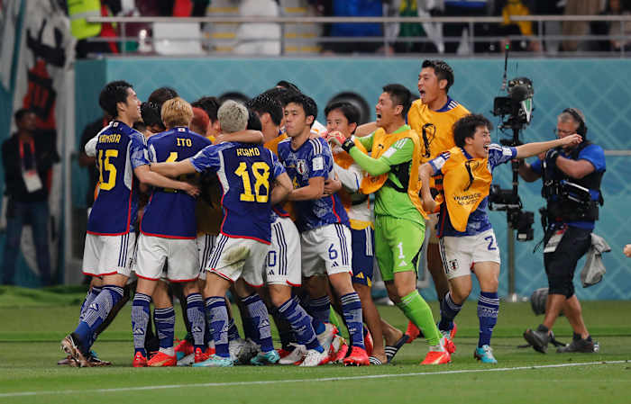 Players of Japan pictured celebrating during their 2-1 win over Germany at the 2022 FIFA World Cup in Qatar
